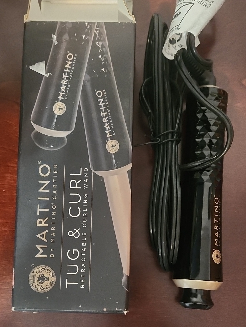 Martino cartier tug and curl retractable curling wand. Perfect for travel.